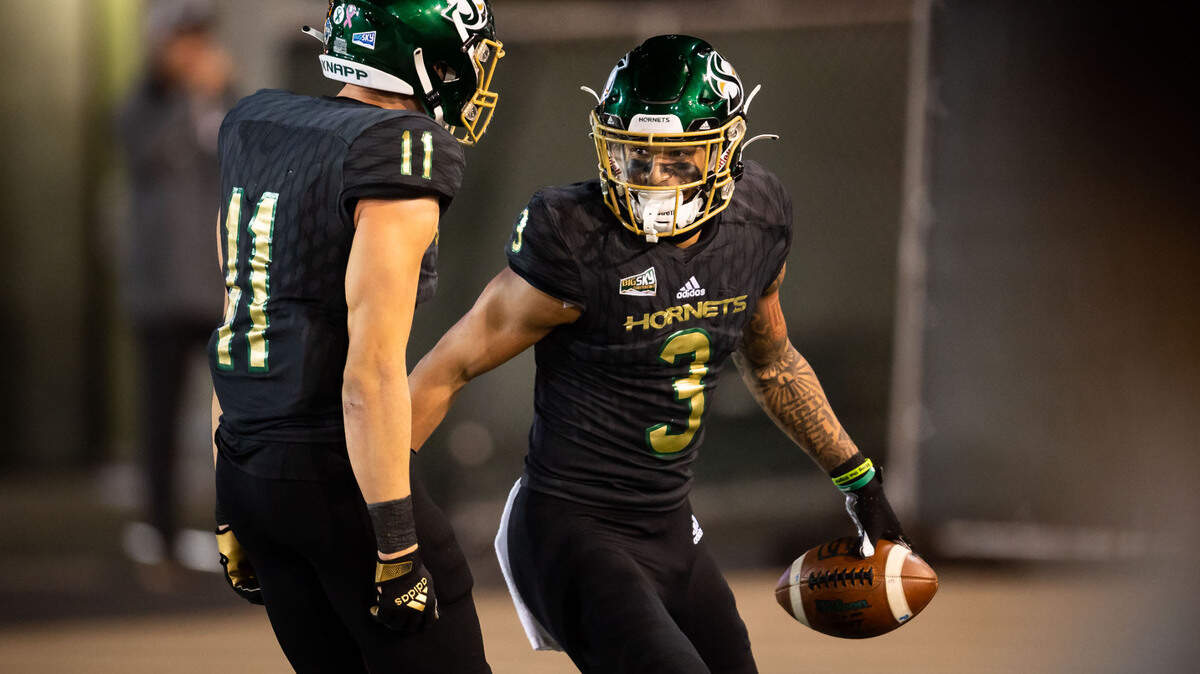 Sacramento State Hornets wide receiver Chris Miller (3), right, is congratulated by teammate wide receiver Parker Clayton (11) after a long touchdown reception against Northern Arizona University during the second half of the Hornets’ homecoming NCAA football game Saturday, Oct. 23, 2021, at Hornet Stadium in Sacramento.