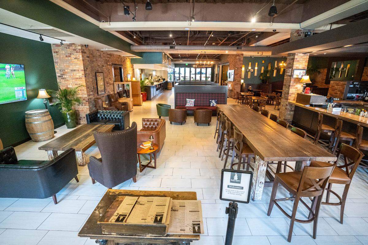 Bear & Crown British Pub has an English feel to it with brick walls and seating with a plaid patterns, Thursday, Aug. 24, 2023.
