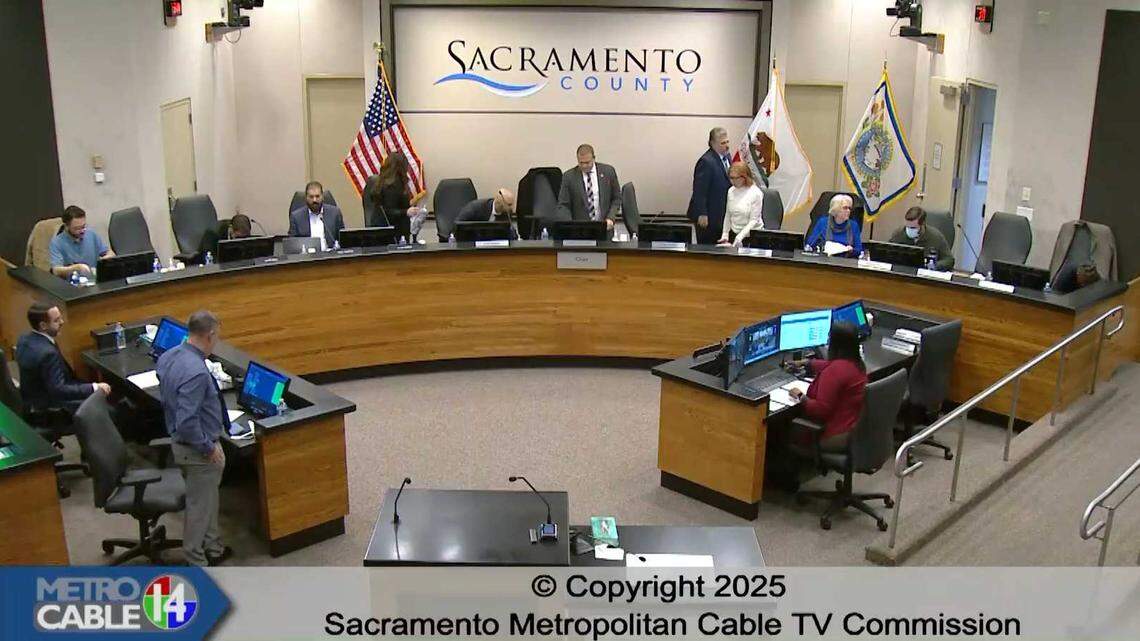 The Sacramento Metropolitan Cable Television commissioners leave county chambers after abruptly adjourning a meeting Thursday without discussing a budget item.