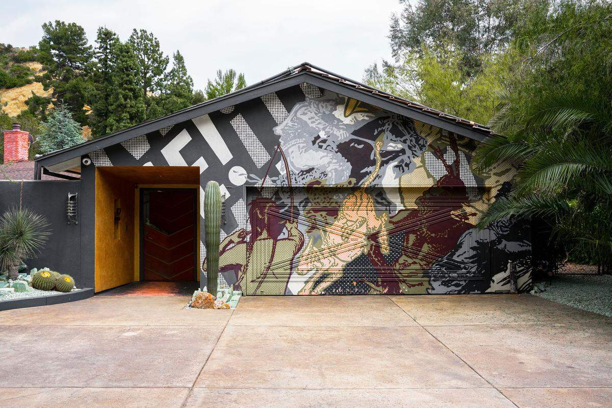 Ed Ruscha transformed two 1950s ranch houses into a free-flowing oasis, complete with cactus gardens, a meditation studio, and the spirit of California creativity.