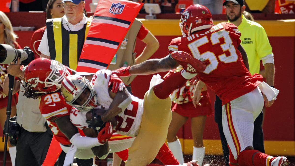 Kansas City Chiefs defensive back Ron Parker tackles 49ers running back Matt Breida during Sunday’s game at Arrowhead Stadium.