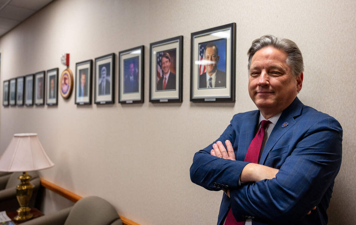 U.S. Attorney Phillip Talbert stands in a line of former U.S. Attorneys where his photo will soon hang on the wall at the Robert T. Matsui United States Courthouse in Sacramento on Monday. Talbert announced his resignation effective Saturday.