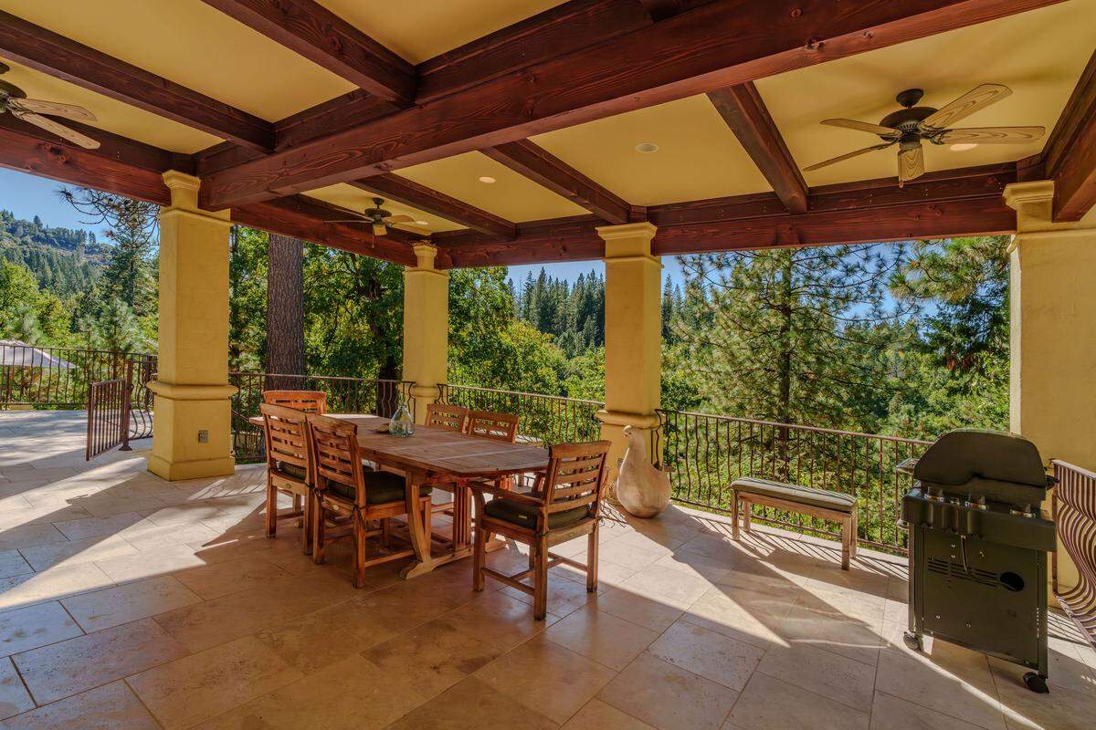 At a glance, the home offers four bedrooms, six baths and 5,050 square feet of living space — with terraces overlooking 42.3 acres bordering national forest. It’s listed at $2.5 million, at 4581 E Highway 4.