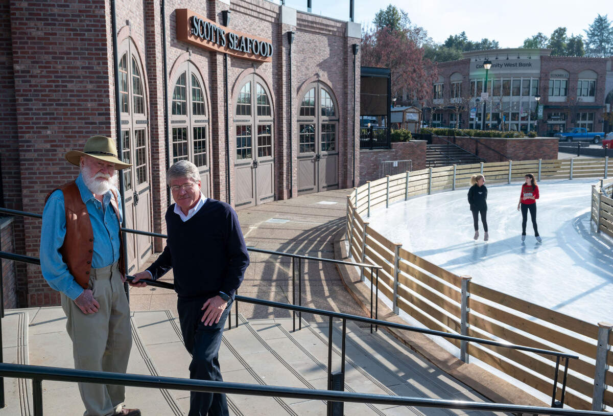 Folsom resident historian Bill Anderson, left, founding president of the Folsom, El Dorado & Sacramento Historical Railroad Association in 1995, who now leads the city’s railroad museum, stands in the historic district with developer Jerry Bernau near the Roundhouse Restaurant and holiday ice rink.