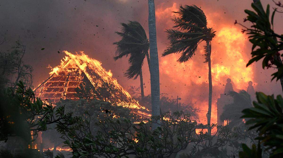The hall of historic Waiola Church in Lahaina and nearby Lahaina Hongwanji Mission are engulfed in flames along Wainee Street on Tuesday, Aug. 8, 2023, in Lahaina, Hawaii.