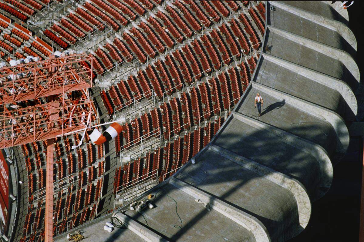 A structural engineer checks for damage to Candlestick Park’s canopy the day after the Loma Prieta earthquake of 1989 which caused a delay in the World Series between the Oakland A’s and the San Francisco Giants at Candlestick Park.