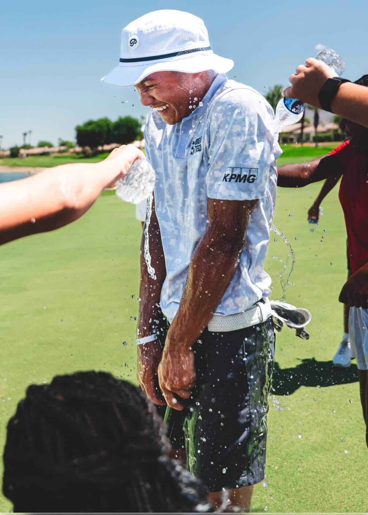 Jayden Lizama is doused with water after winning at the Jack Nicklaus Tournament Course at PGA West in Palm Springs in 2025. The victory secured Lizama, a Franklin High School graduate from Elk Grove, an automatic spot in the Curry Cup championship in Jersey City, N.J.