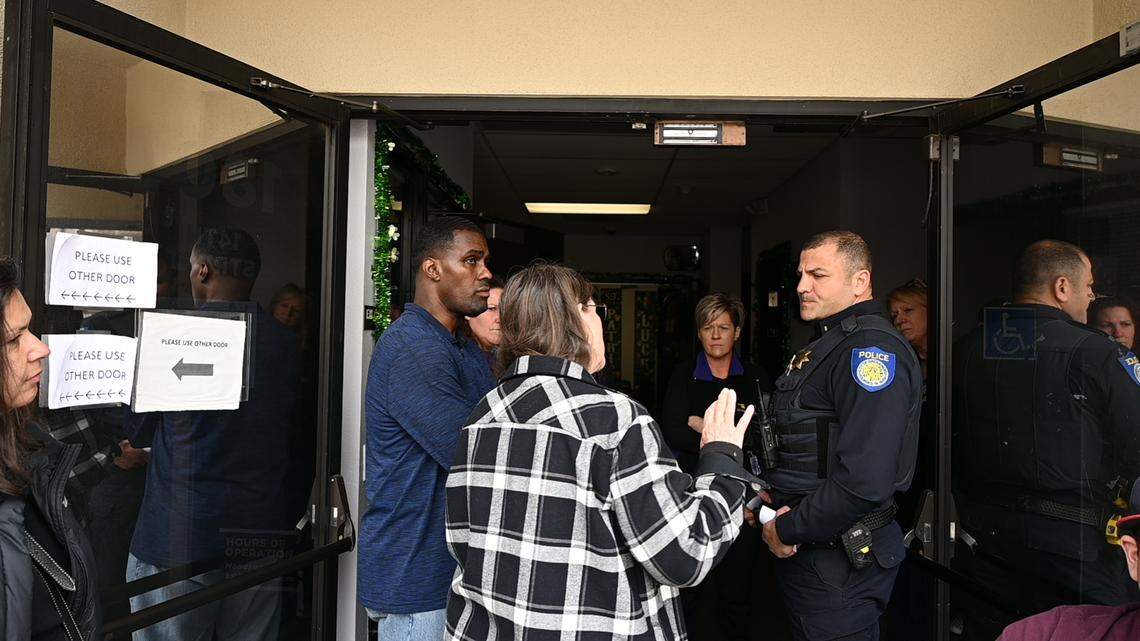 SEIU Local 1000 president Richard Louis Brown talks with a Sacramento police officer Saturday after he and about 20 supporters gained access to the Sacramento headquarters building after the locks had been changed. Three union vice presidents locked him out after taking action to suspend him.