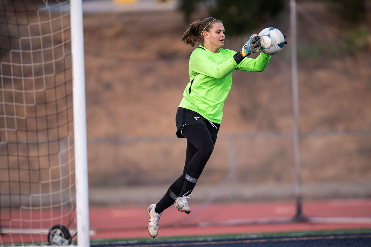 Oak Ridge Trojans’ Kate Plachy (1) makes a save during the first half against the Buchanan Bears at the high school girls soccer CIF NorCal Division I championship game Saturday, March 5, 2022, at Oak Ridge High School in El Dorado Hills. Oak Ridge came from behind to tie Buchanan 2-2, survived overtime then won after penalty kicks.