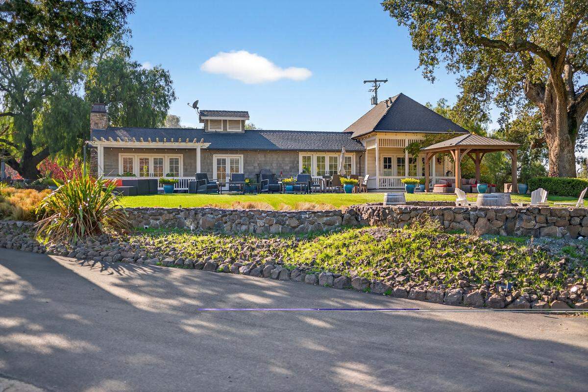 In addition to the main house, shown above, a separate guest house adds 2,300 square feet with three bedrooms and three bathrooms, allowing space for extended family, caretakers, visiting trainers or event-related stays.