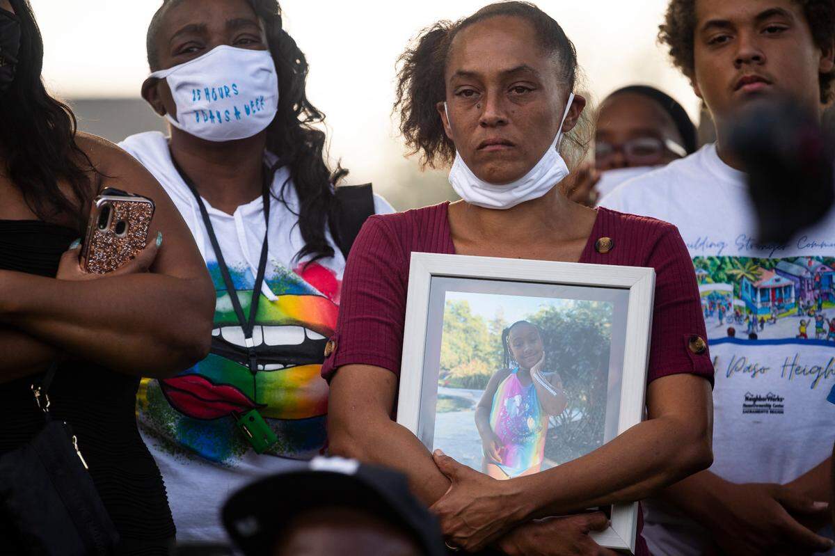 Amber Brent, grandmother of Makaylah Brent, 9, who was fatally shot Saturday, holds her granddaughter’s picture at a news conference at Mama Marks Park on Tuesday, Oct. 6, 2020, in Sacramento’s Del Paso Heights neighborhood.