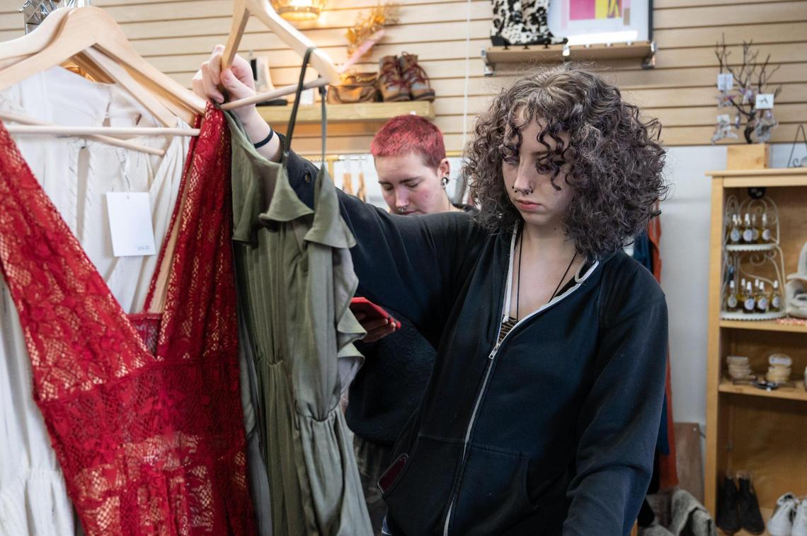 Sadie Jackson, 17, of Chico, looks for clothes before going to the Van Gogh Sacramento Exhibit on in November at Threadeco in Old Sacramento.