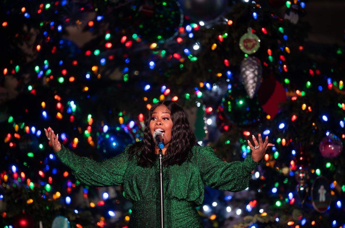 Amber Riley, introduced for her role on “Glee” and as an accomplished performer, sings “What Christmas Means to Me” during the 90th annual California State Capitol Tree Lighting Ceremony in 2021.