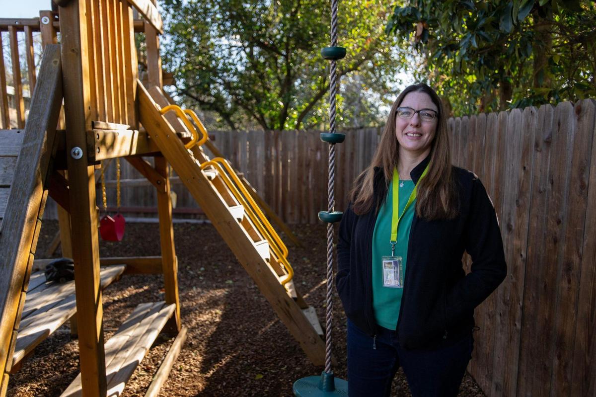 Executive director Alyssum Maguire stands near a play structure at Progress Ranch, a short-term residential care facility for boys ages 6 to 13, many of whom are in foster care, in Davis.