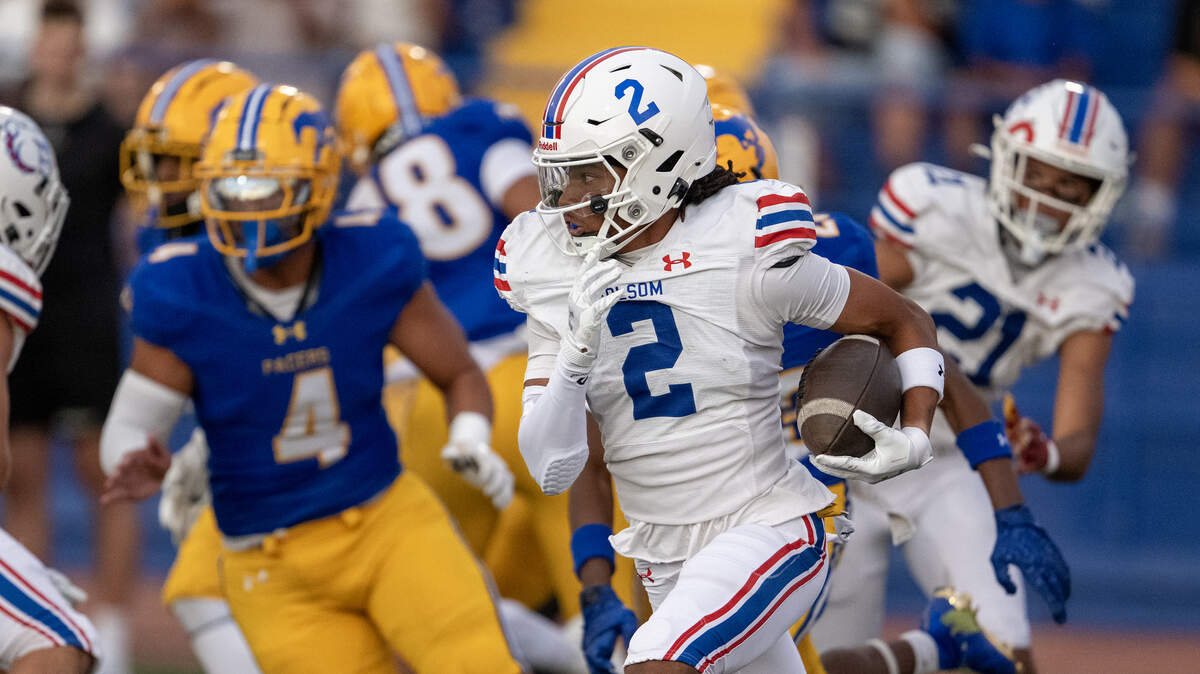 Folsom Bulldogs punt returner Jameson Powell (2) fumbled a ball inside the Bulldogs 10 yard line, and returned it for a touchdown against the Grant Pacers in the first half on Saturday, Aug. 23, 2025, in Del Paso Heights.