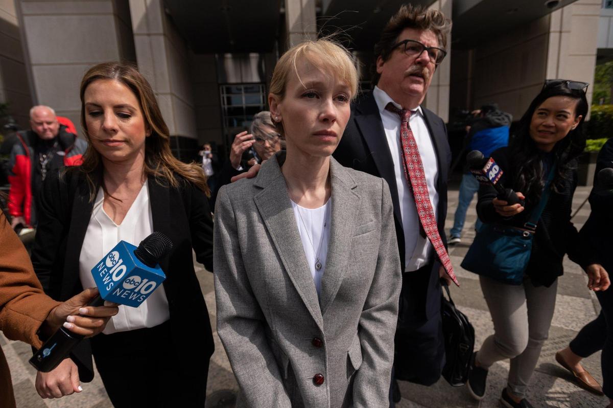 Sherri Papini leaves with attorney William Portanova after arraignment at the Robert T. Matsui United States Courthouse in Sacramento, Wednesday, April 13, 2022. Six weeks after Sherri Papini was arrested and charged with faking her own kidnapping in 2016, the so-called Super Mom from Redding has signed a plea deal and will admit that she orchestrated the hoax. The plea agreement has been delivered to prosecutors in the U.S. Attorney’s Office in Sacramento, which filed a charging document called an “information” Tuesday afternoon charging her with 34 counts of mail fraud and one count of making false statements.