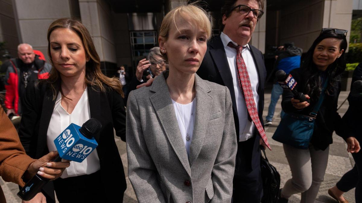 Sherri Papini leaves with attorney William Portanova after arraignment at the Robert T. Matsui United States Courthouse in Sacramento, Wednesday, April 13, 2022.