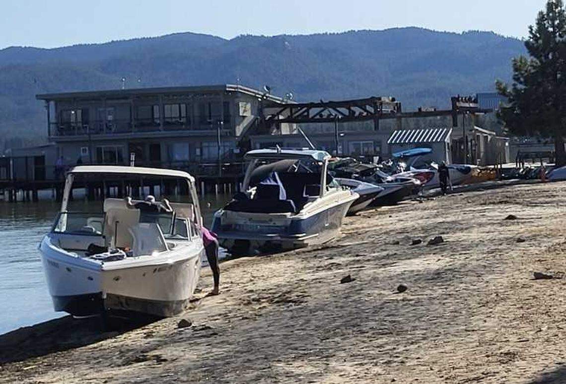 Boats washed up to shore at Conolley Beach in South Lake Tahoe on Saturday. Officials are investigating the extent of damage to boats besides the 27-foot Chris-Craft that capsized.