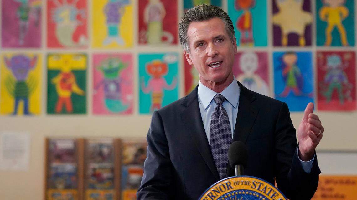 Gov. Gavin Newsom speaks at a news conference at James Denman Middle School in San Francisco, Friday, Oct. 1, 2021. He is proposing that California lawmakers approve $1.4 billion in emregency spending to address the COVID-19 omicron variant. (AP Photo/Jeff Chiu)