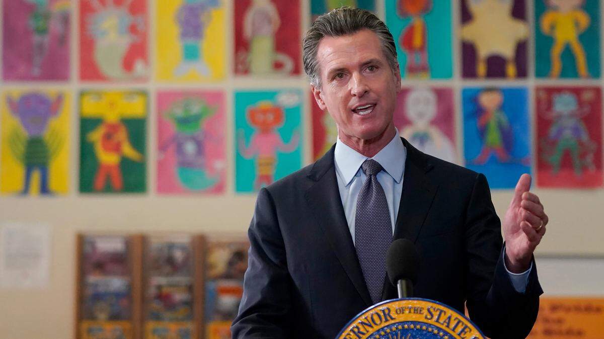 Gov. Gavin Newsom speaks at a news conference at James Denman Middle School in San Francisco, Friday, Oct. 1, 2021. He is proposing that California lawmakers approve $1.4 billion in emregency spending to address the COVID-19 omicron variant. (AP Photo/Jeff Chiu)