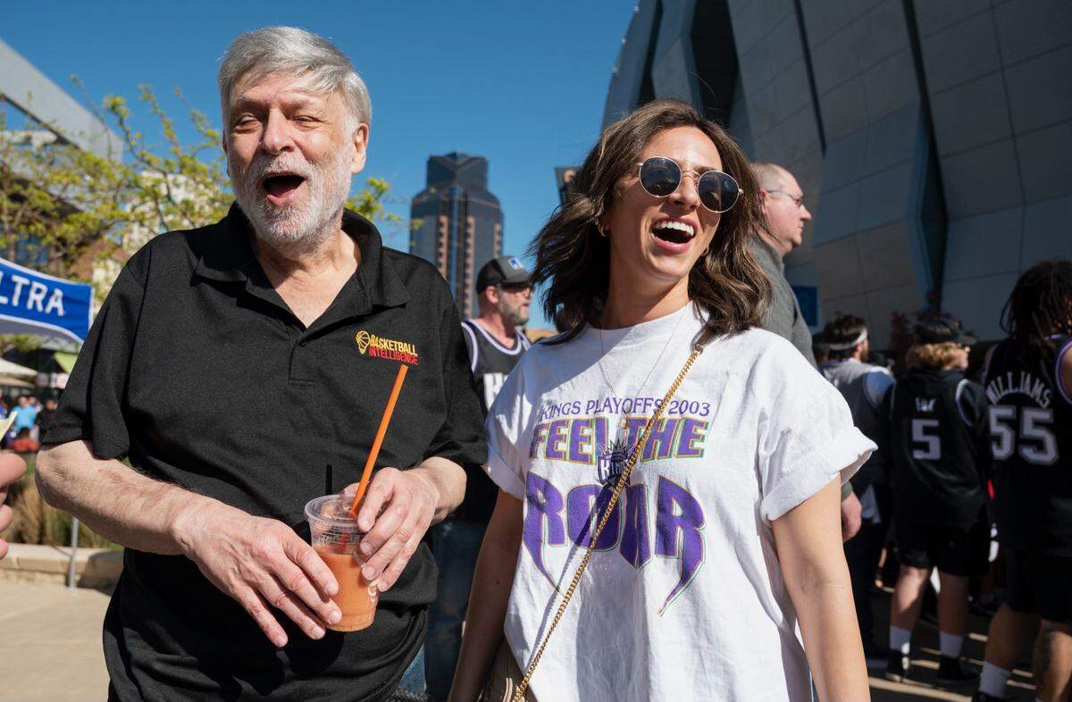 Sacramento Kings fans Ray LeBov and daughter Lauren LeBrov laugh outside Golden 1 Center before Game 1 of their team’s NBA playoff series against the Golden State Warriors on Saturday, April 15, 2023. Lauren’s vintage Kings playoff T-shirt dates from 2003.