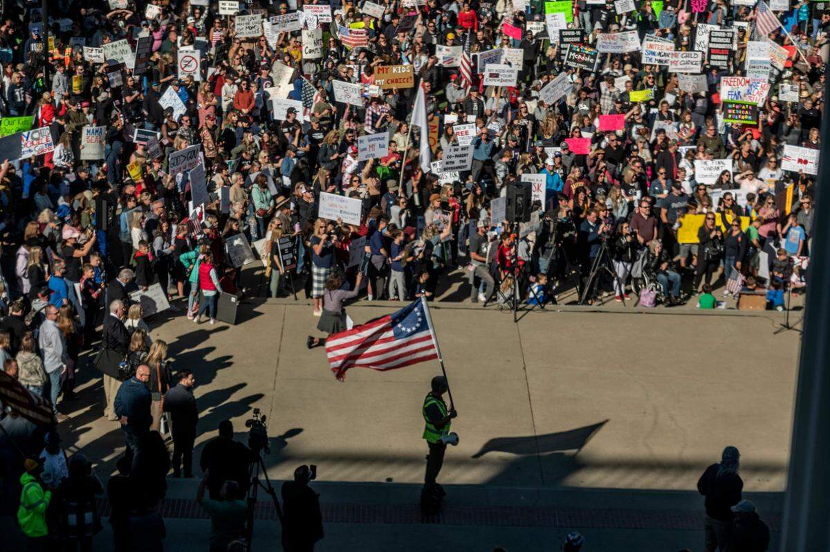 Thousands attend the “Keep Your Kids Home From School” rally to protest mandatory COVID-19 vaccinations for school children at the state Capitol on Monday.