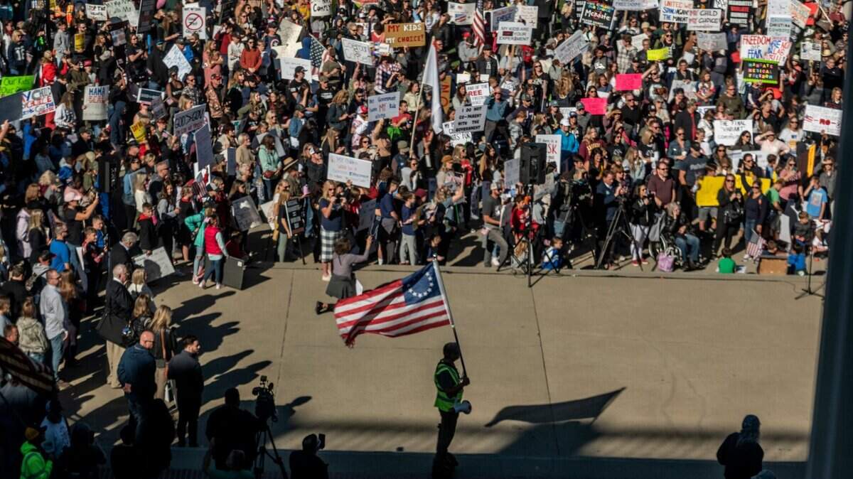 A large crowd attends a Keep Your Kids Home From School rally to protest mandatory COVID-19 vaccinations for schoolchildren at the state Capitol on Monday, Oct. 18, 2021.