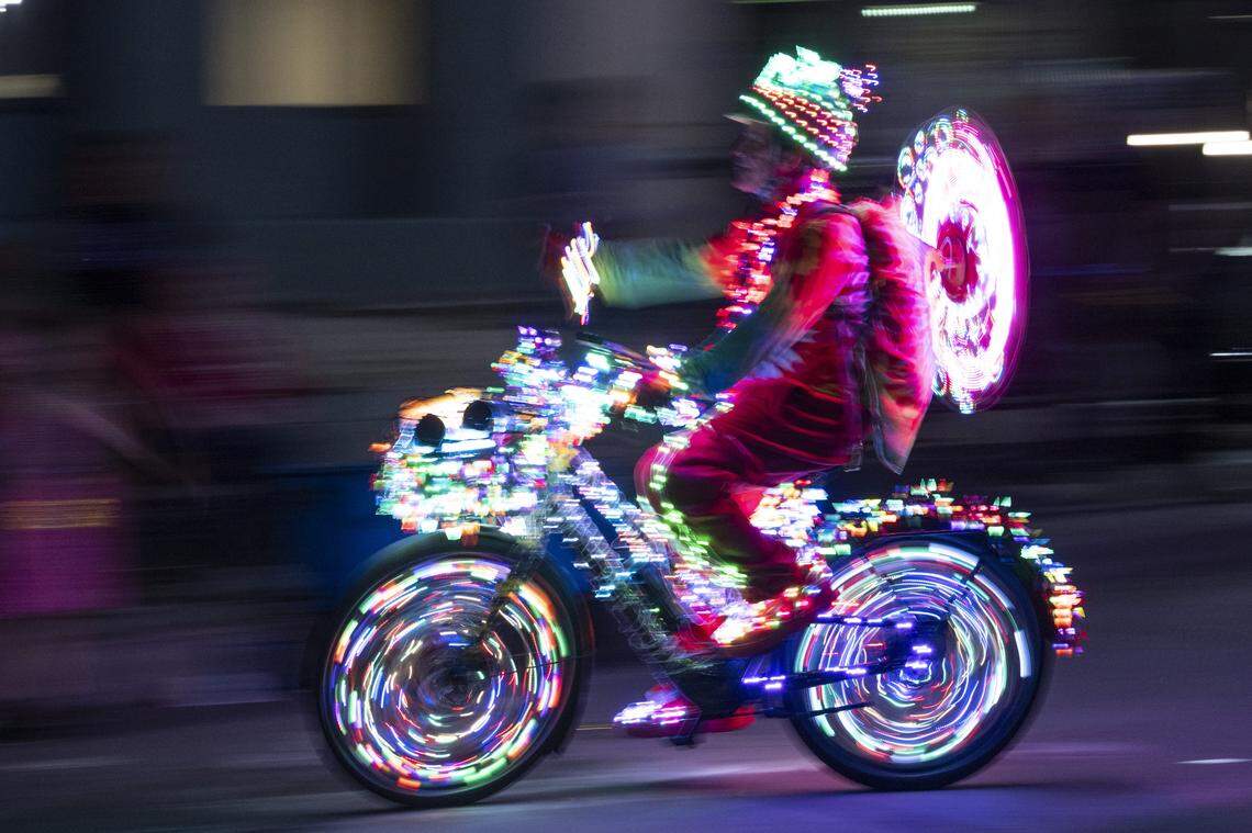 A Bike Party rider rolls down Capitol Mall during the City of Trees Parade in Sacramento on Saturday, Feb. 28, 2026.
