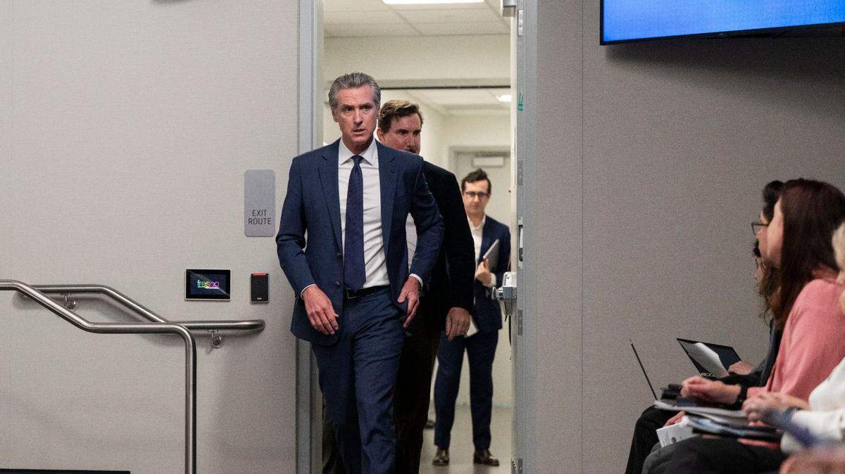 Gov. Gavin Newsom enters a news conference to present the May revision to the state budget on May 14 in the Capitol Swing Space. Newsom's administration is negotiating with unions to achieve $800 million in savings through compensation-related reductions.