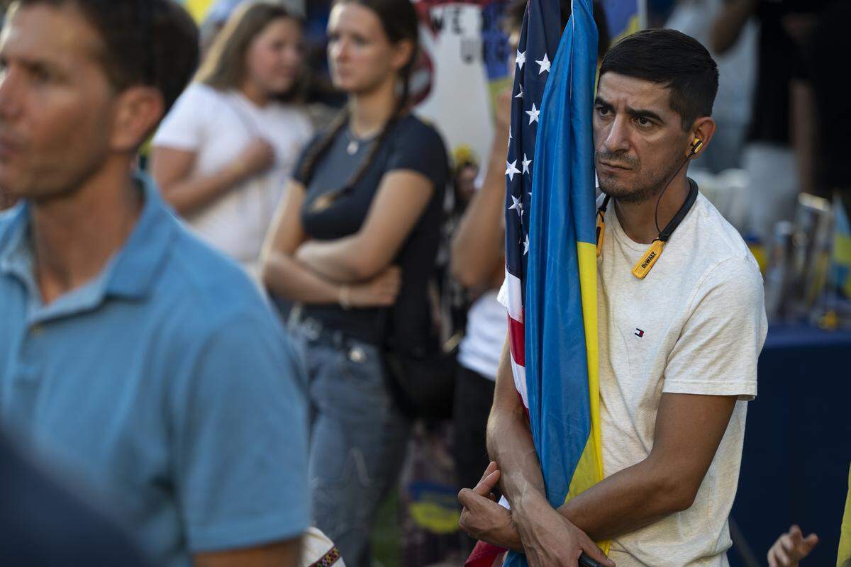 Ukrainian Americans react to a video message from Ukrainian President Volodymyr Zelenskyy during a Ukrainian Independence Day celebration at the California Capitol in Sacramento on Sunday.