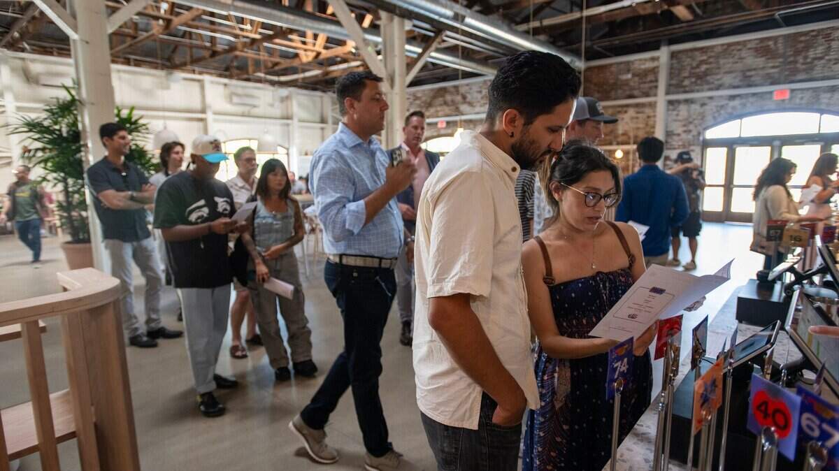 Diners view the menu at Slow & Low Smokehouse during the restaurant’s soft opening on May 29, 2024, in Elk Grove. The site has since closed and reopened as Horn Barbecue.