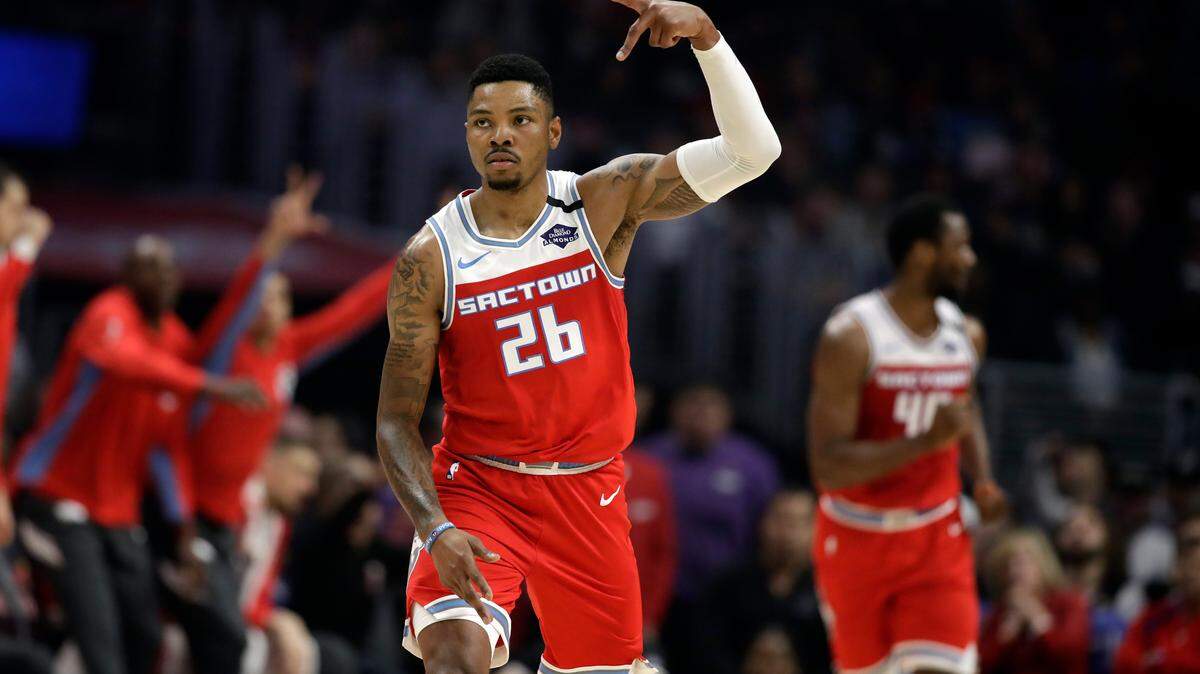 Sacramento Kings’ Kent Bazemore (26) reacts after scoring against the Los Angeles Clippers during the first half of an NBA basketball game Saturday, Feb. 22, 2020, in Los Angeles. (AP Photo/Marcio Jose Sanchez)