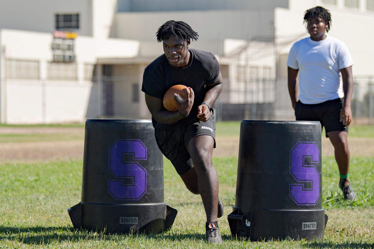 Sacramento High School running back Lamar Radcliffe, a Utah Utes commit, participates in drills on campus Tuesday, July 25, 2023, after recovering from a knee injury last season.