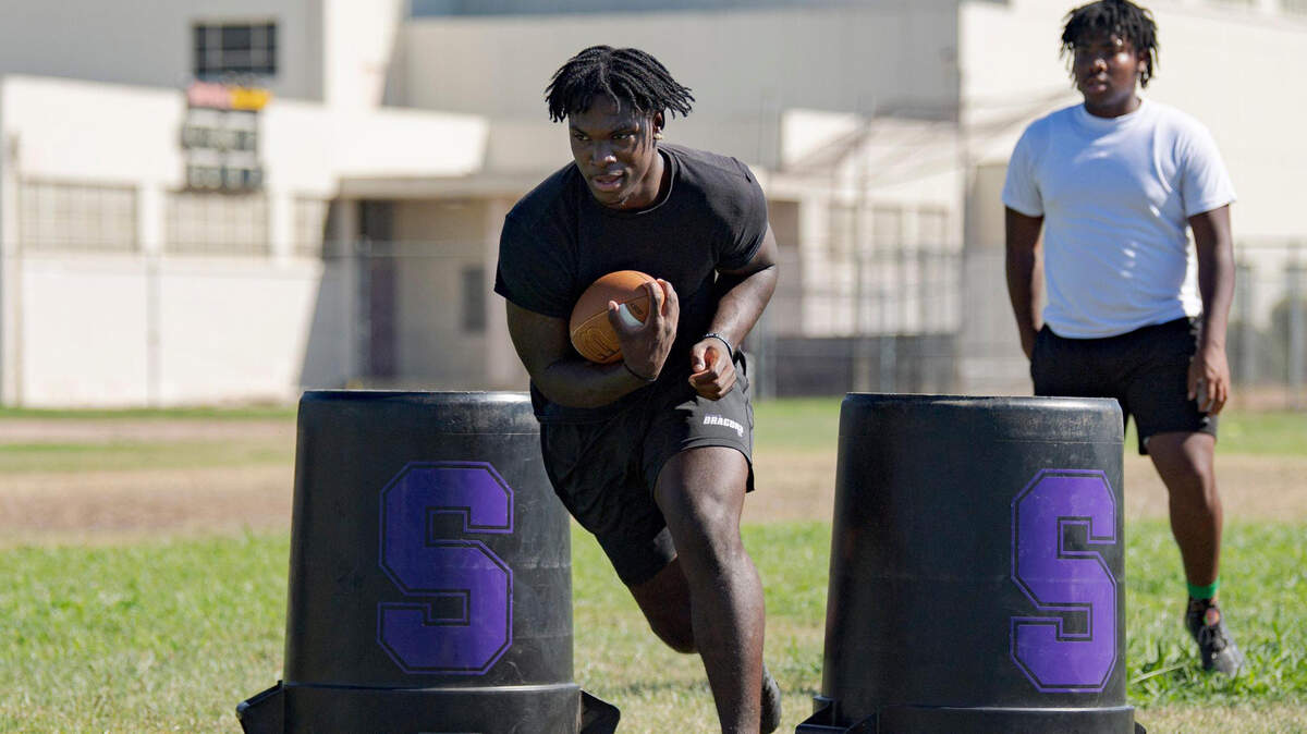 Sacramento High School running back Lamar Radcliffe, a San Jose State commit, participates in drills on campus Tuesday, July 25, 2023, after recovering from a knee injury last season.