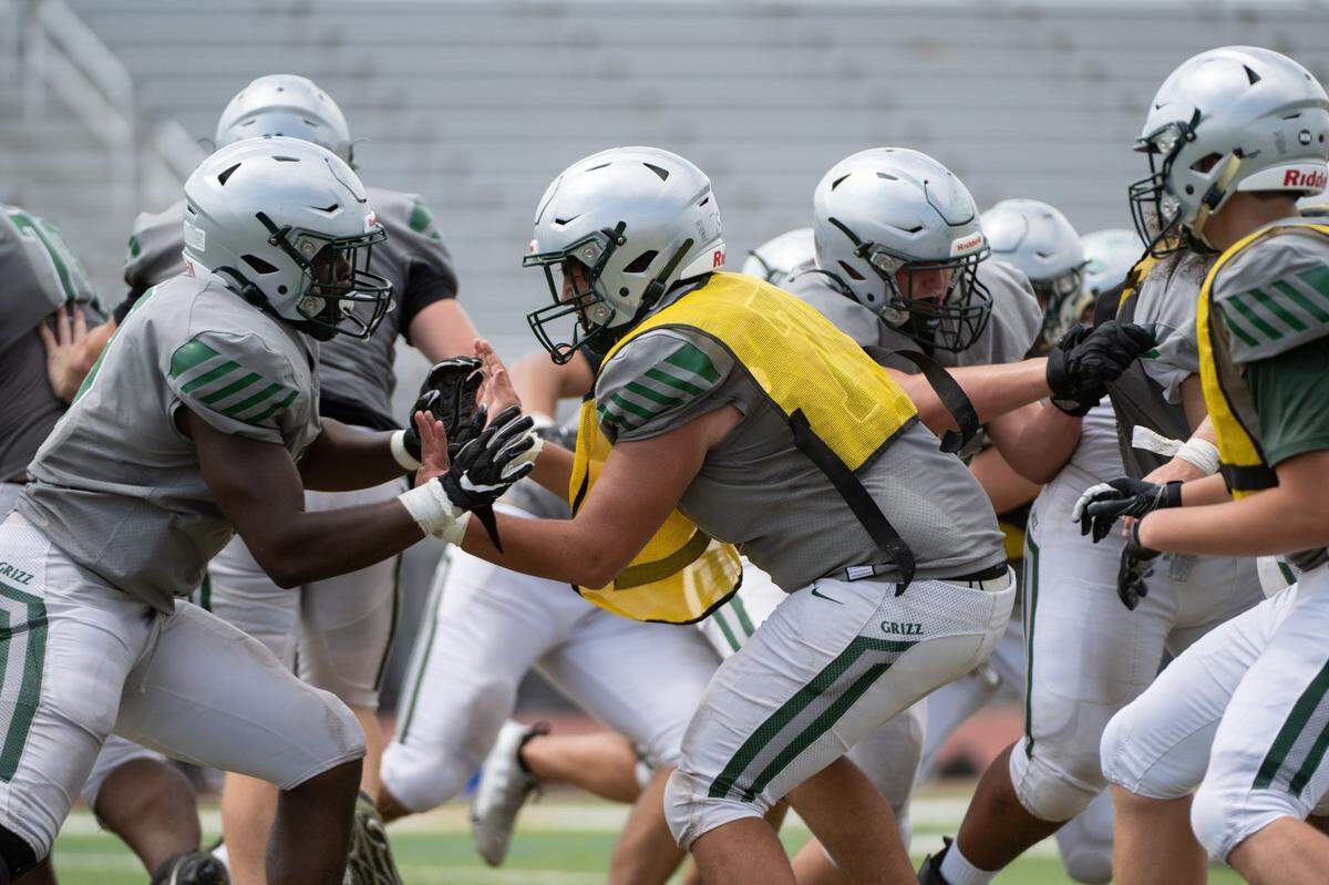 Granite Bay football players practice in pads in 2022. The team has reduced contact in practices to avoid injuries and concussions.