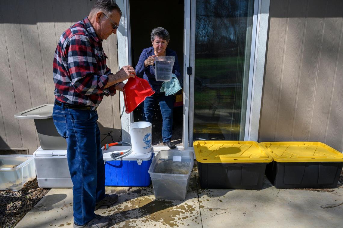 Jim Wilson and his wife Marty collect rain water to shower and wash their clothes on Wednesday, April 10, 2019 in Paradise. Benzene, a cancer-causing compound, has been found in the Paradise water system. Jim has hooked up a battery operated shower in their bathroom.