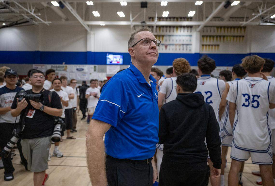 The Folsom Bulldogs coach Mike Wall looks up at the final score after the Bulldogs defeated the Kings Academy Knights in the CIF Northern California Regional Division I boys basketball championship on Tuesday in Folsom.