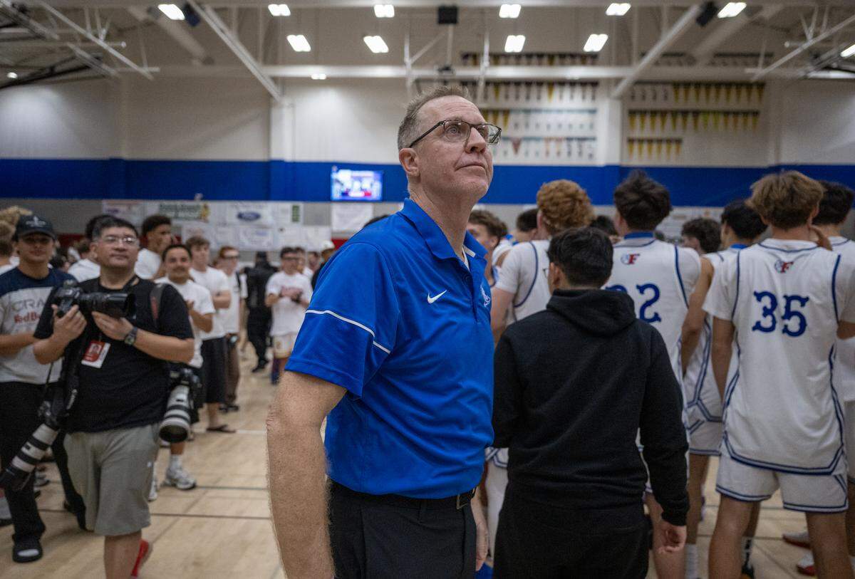 The Folsom Bulldogs coach Mike Wall looks up at the final score after the Bulldogs defeated the Kings Academy Knights in the CIF Northern California Regional Division I boys basketball championship on March 10 in Folsom.
