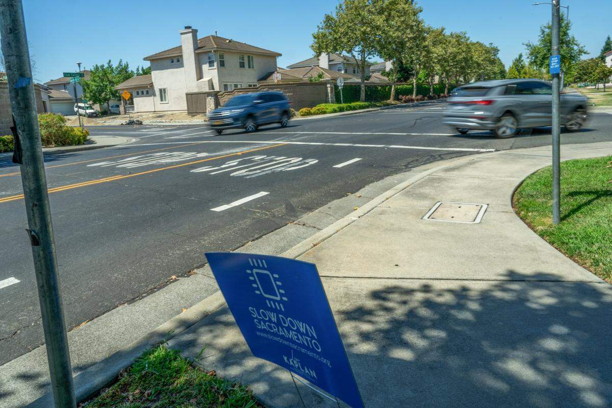 Several signs can be seen on July 8 urging motorists to slow down near the intersection of Club Center Drive and Banfield Drive where Sau Voong, 84, lost his life riding his bicycle when he was hit by a motorist June 11. The speed limit on Club Center, which winds through a residential neighborhood and past several parks, is 35 mph.&nbsp;