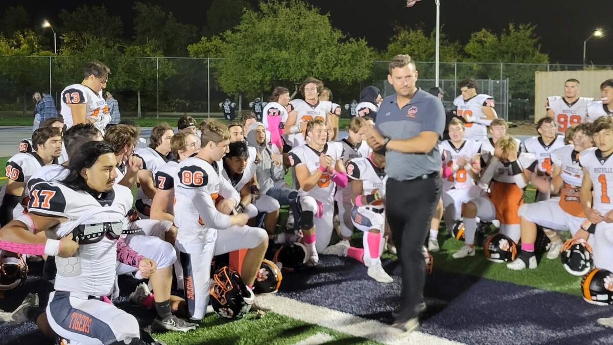 Roseville players and coaches huddle up after a 33-31 win over Inderkum on Friday, Oct. 21, 2022.