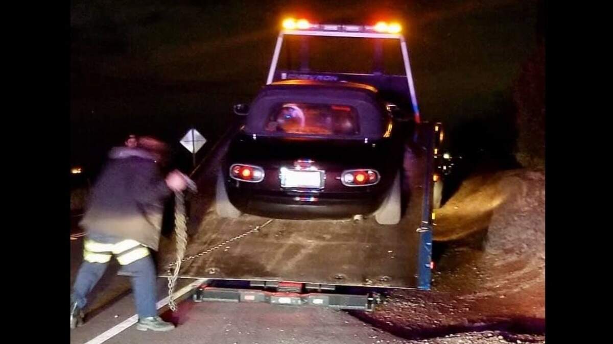 A Mazda Miata is loaded on a tow truck after being impounded by California Highway Patrol officers on Nov. 29. The Miata and a Ford Mustang were seen doing donuts near Eagles Nest Road and the Jackson Highway.