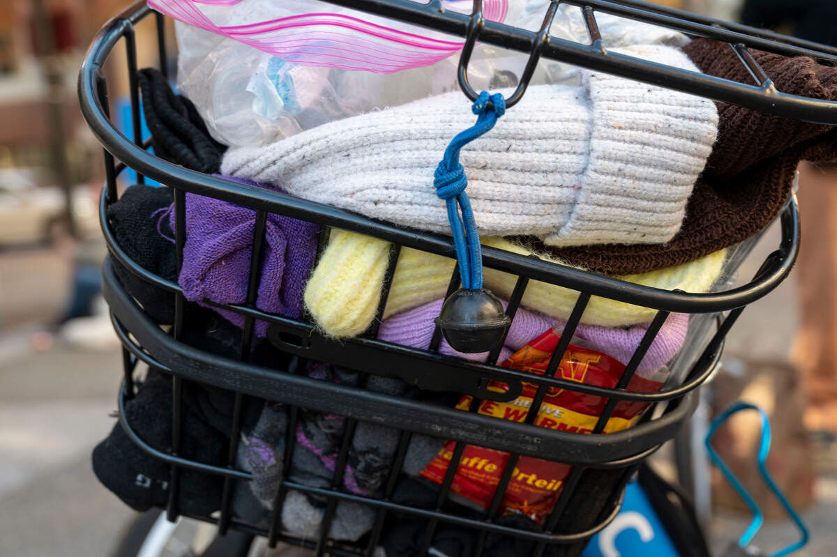 Sister Libby Fernandez’s trike basket is filled with socks and other supplies earlier this month in front of the Cathedral of the Blessed Sacrament. Mercy Pedalers are asking for sleeping bags, socks, underwear and other supplies for homeless.