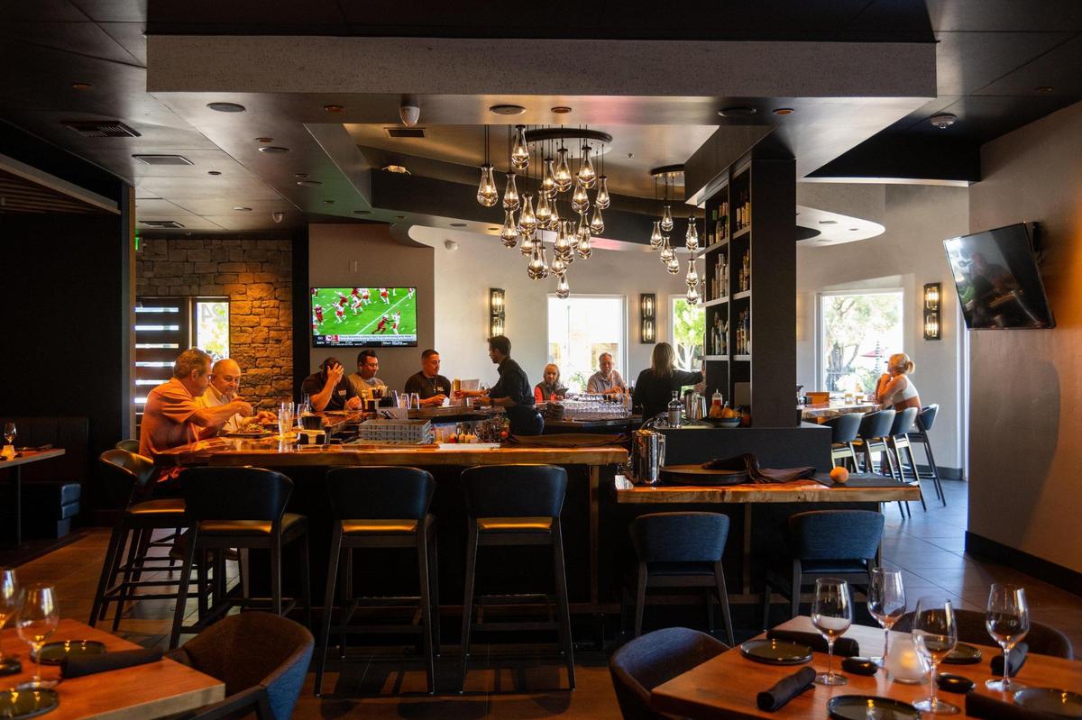 Customers eat and have drinks at the bar Tuesday, Sept. 13, 2022, at South Fork Grill, which opened last month in El Dorado Hills Town Center in El Dorado Hills.