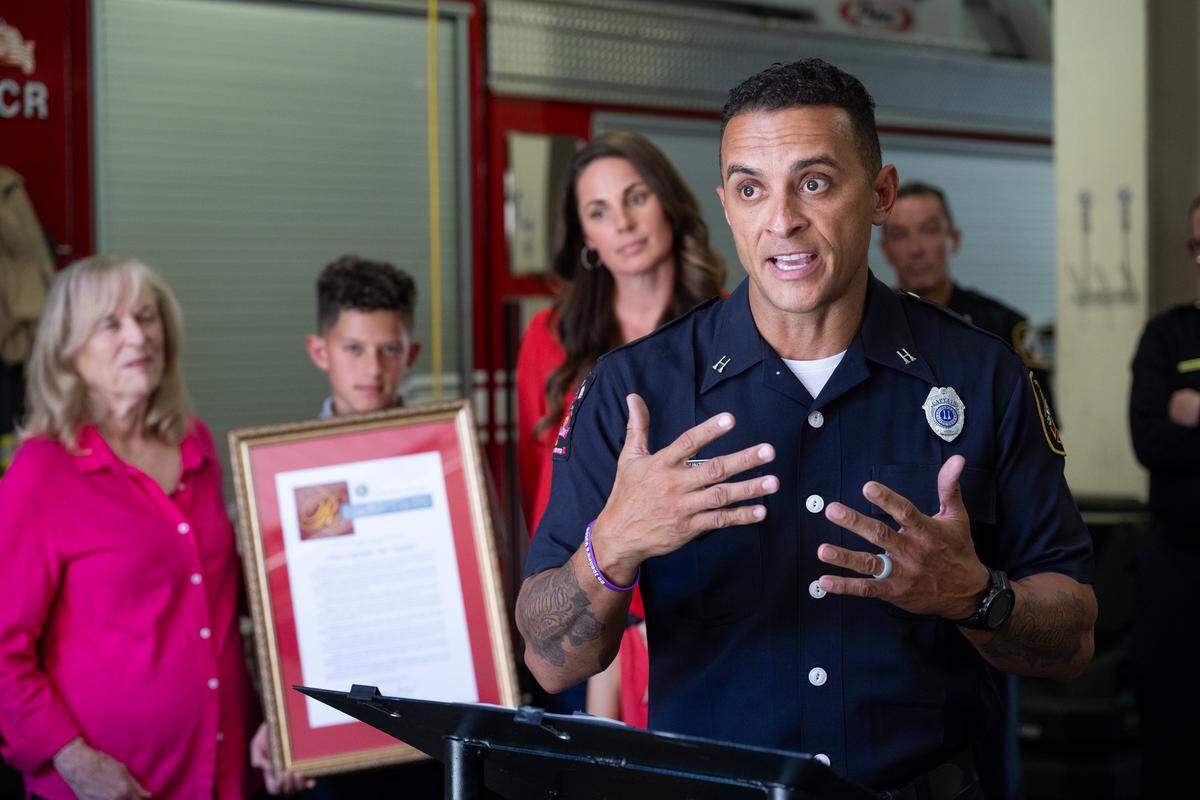 Sacramento Fire Capt. Joe Hunter, joined by his family, is honored by the city of Sacramento and the California Senate during a ceremony at Fire Station No. 2 on Monday, Aug. 25, 2025, for the bravery he displayed on the reality TV show "Survivor," his service to Sacramento as a firefighter, and his advocacy on behalf of domestic violence victims and their families. Hunter is returning to “Survivor” for the show’s milestone 50th season.