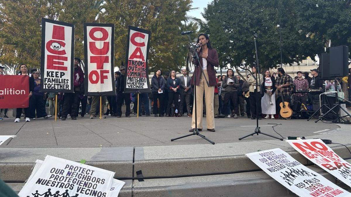 San Francisco Supervisor Jackie Fielder addresses a rally after President Donald Trump said that he had called off 100 immigration agents from “surging” into the city on October 23, 2025.