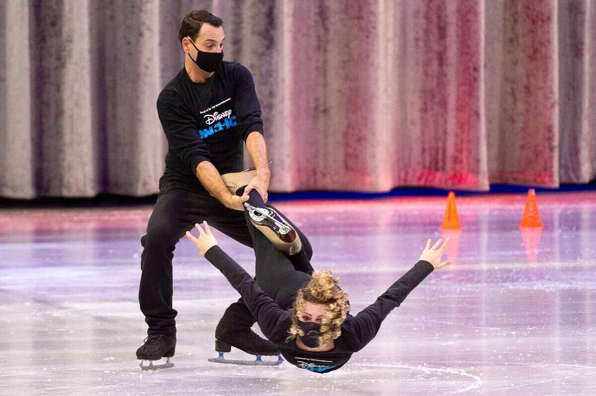 Ice skater Haylie Ferreira warms up with Terry Lawton for her performance in the Disney on Ice at Golden 1 Center in Sacramento on Thursday.
