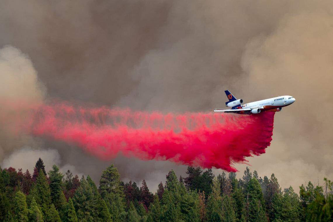 An air tanker drops fire retardant on the Mosquito Fire as smoke fills the sky above Foresthill on Wednesday, Sept. 7, 2022.