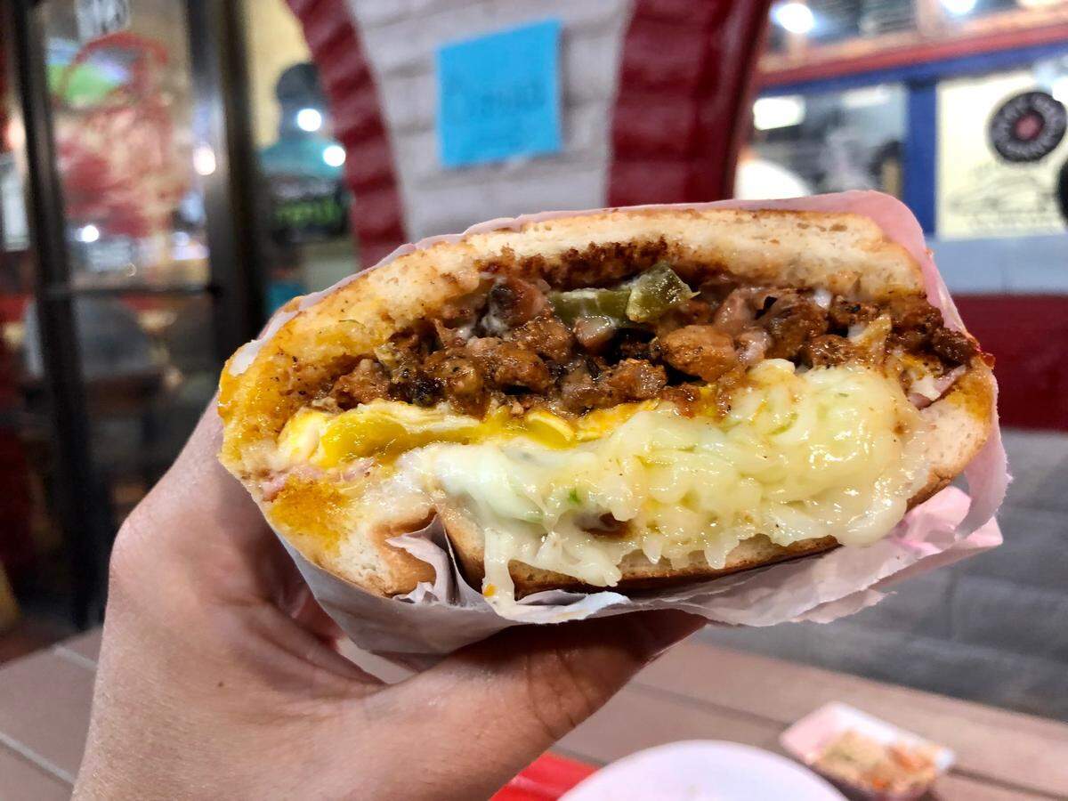Pupuseria La Chicana has tortas, such as this take on a Cubano with a fried egg.