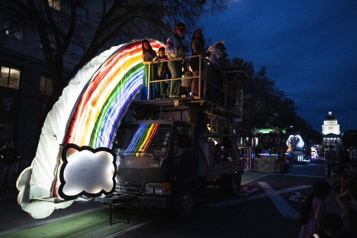 A giant rainbow float drives down Capitol Mall during the City of Trees Parade in Sacramento on Saturday, Feb. 28, 2026.