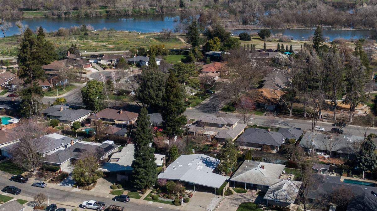The mid-century modern home sits in the desirable River Park neighborhood, near Paradise Beach and Sacramento State.